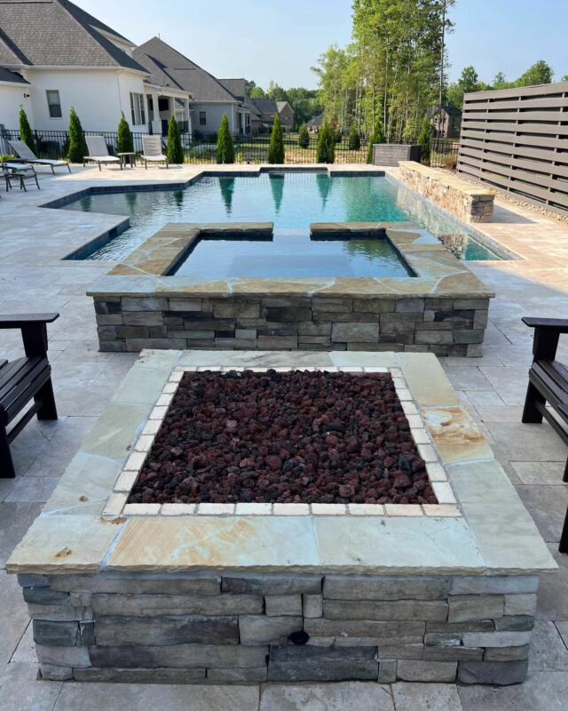 Our clients are so happy with how this project turned out, and so are we!!! One of the designers at The Stone collaborated with the owners to custom design this gorgeous outdoor living space. 

We created a unique and super cool pool shape, and designed it with wooden panels to give privacy where needed. 

We chose materials together to complement their style and home, including natural stone crab orchard caps and walnut travertine pool coping and decking.

•
•
•

#stoneman #stonemanrocks #portfolio #backyardpool #charlottemason #customstonework #charlottehardscape #backyarddesign #outdoorentertaining